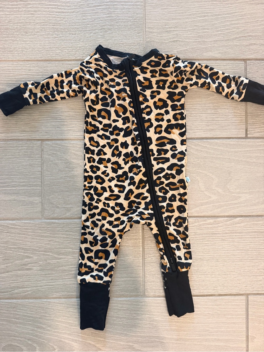 Posh Peanut Leopard Print One-Piece Footie with Black Trim